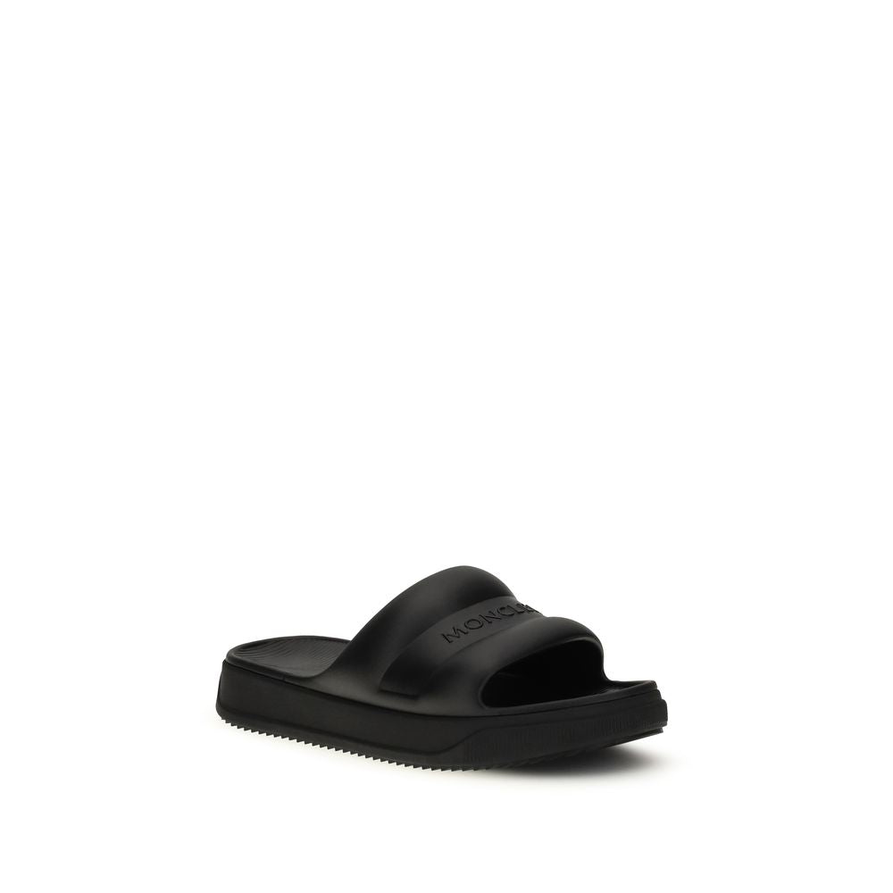 Moncler Schwarze flache Sandalen aus Gummi