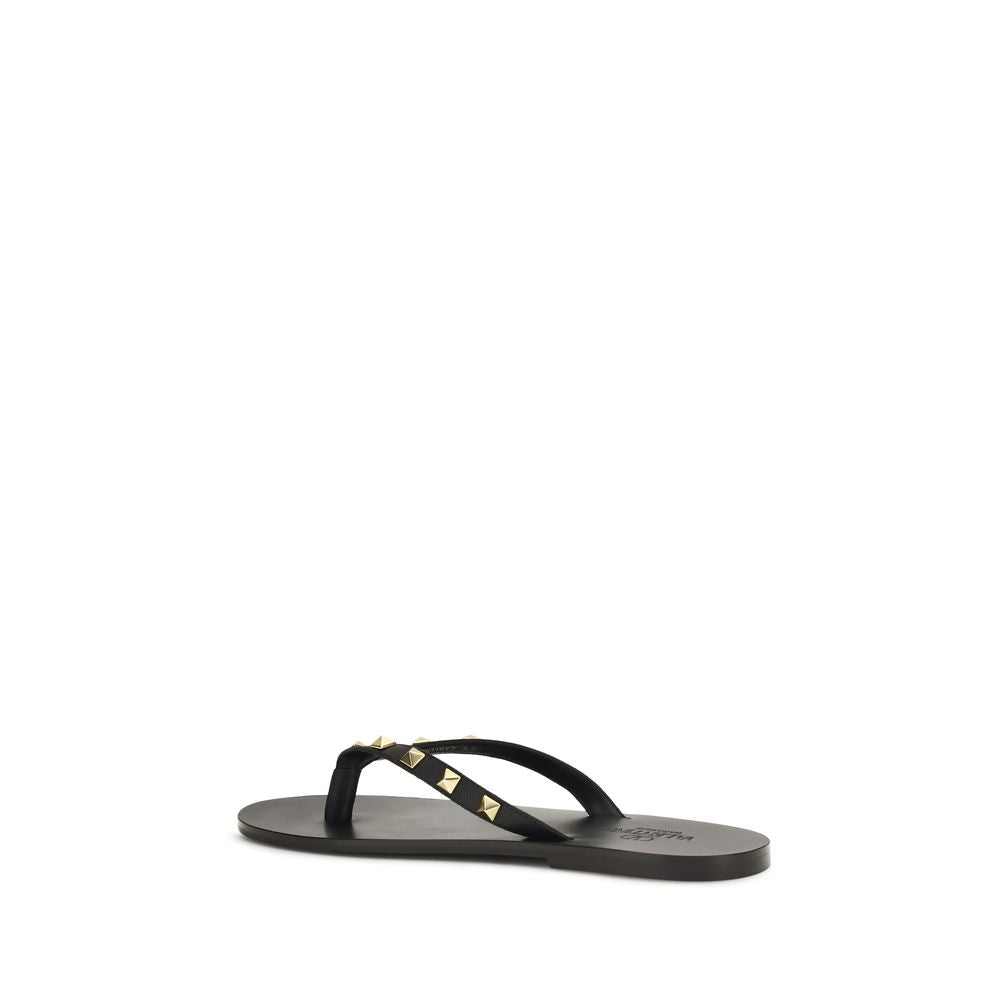 Valentino Garavani Sandales tongs en cuir de veau noir Bos Taurus
