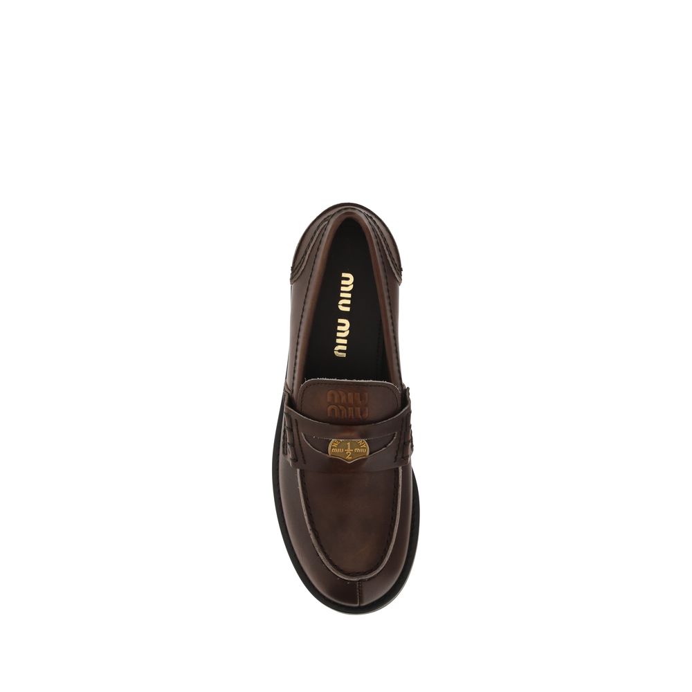 Mocassins à enfiler Miu Miu en cuir de veau marron Bos Taurus